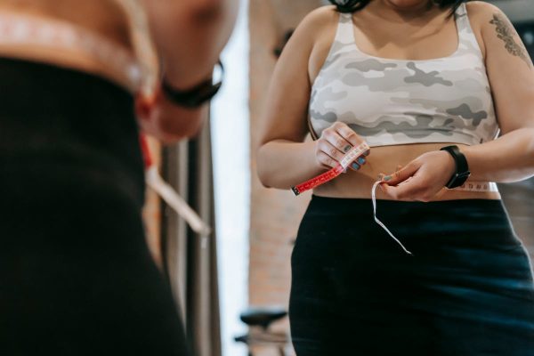 Body measurement consultation for CoolSculpting treatment