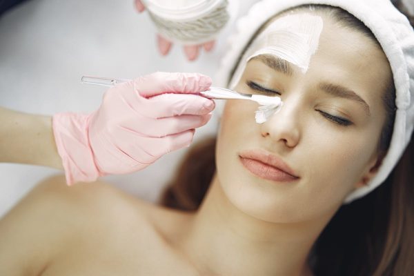 Chemical peel brush application with gloves