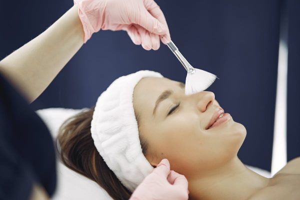 Facial peel treatment with fan brush