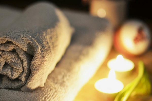 Spa ambiance with towels and candles