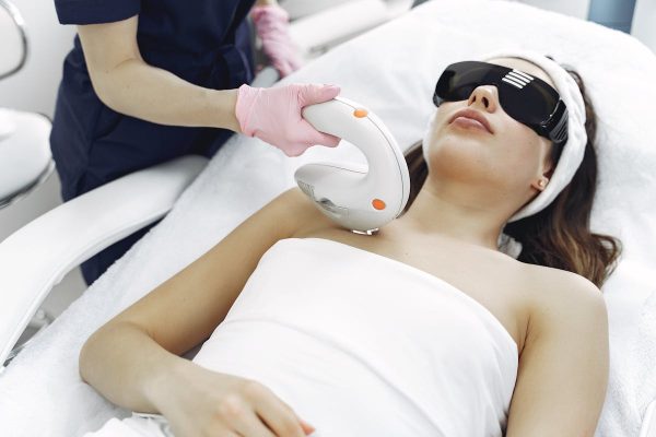 IPL laser facial treatment with protective eyewear