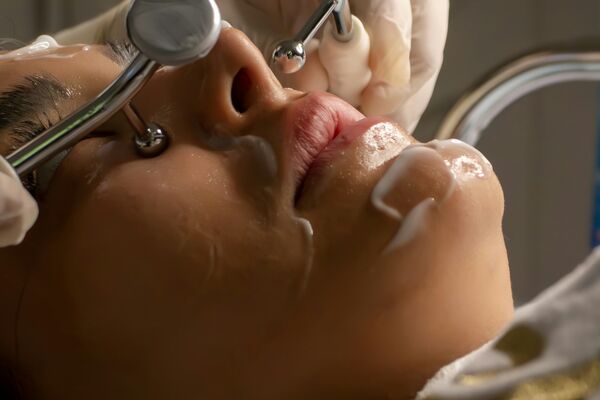 Close-up of laser skin treatment device for facial rejuvenation