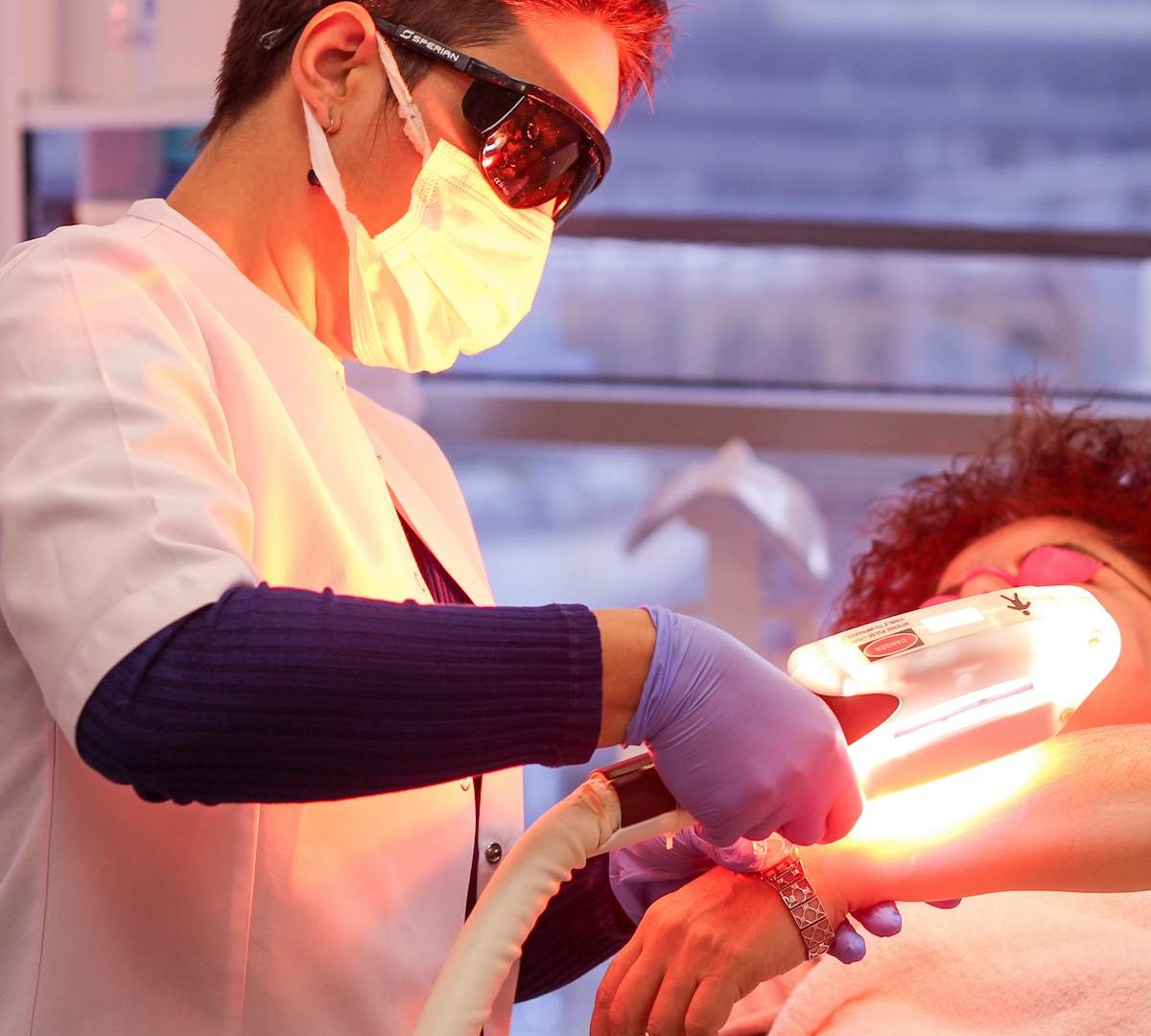 Laser hair removal treatment with safety goggles